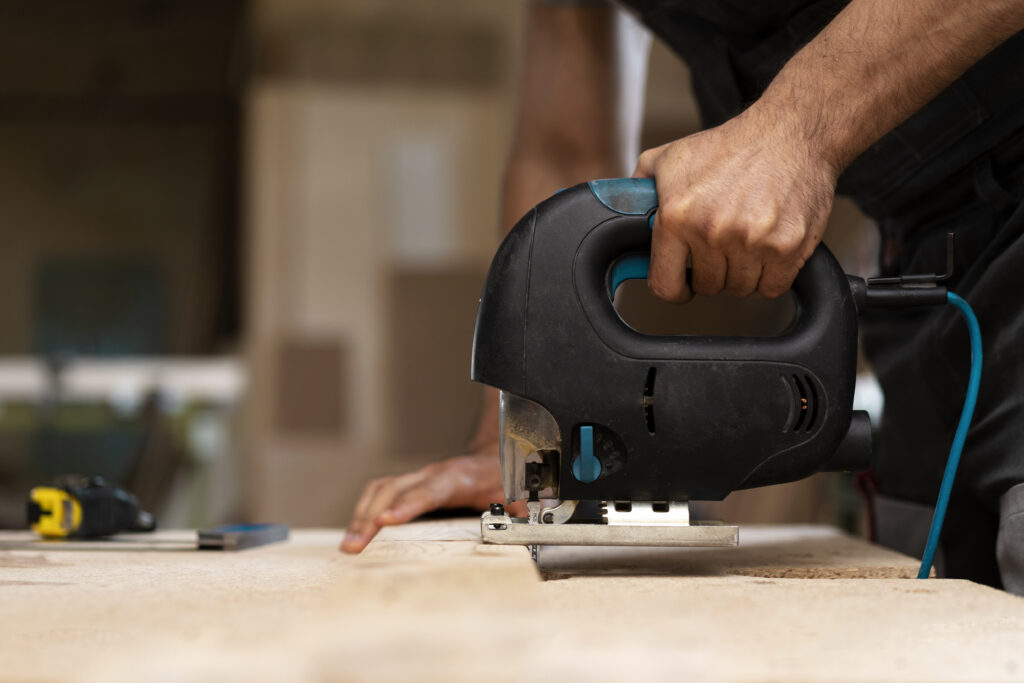 carpenter-cutting-mdf-board-inside-workshop